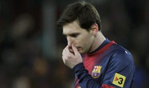 Barcelona's Messi reacts as he leaves the pitch after their Spanish King's Cup semifinal second round soccer match against Real Madrid in Barcelona