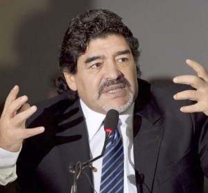 Football legend Argentinian Diego Maradona gestures during a press conference on February 26, 2013 in Naples. Maradona, who rarely stepped foot in Italy since leaving under a cloud in the 1990s amid claims of collusion with mafia dons and a positive drugs test for cocaine, asked for "justice" in his dispute with Italian tax authorities on an emotional trip to Naples -- the scene of some of his greatest career successes.  AFP PHOTO / CARLO HERMANN        (Photo credit should read CARLO HERMANN,CARLO HERMANN/AFP/Getty Images)