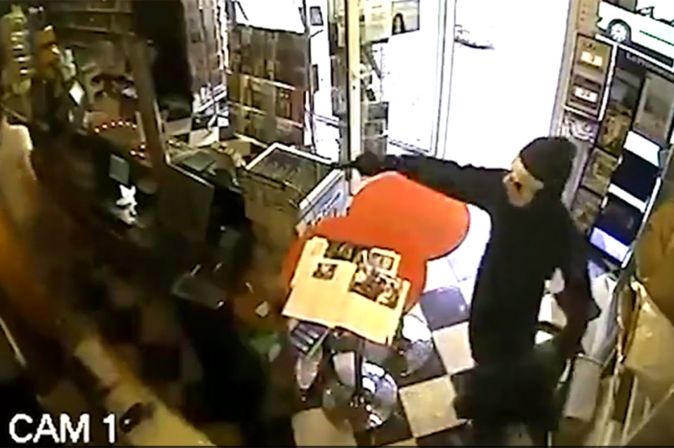 Screen grab taken from CCTV footage: Thief left empty handed as clever shop owner trains his dog to attack on command